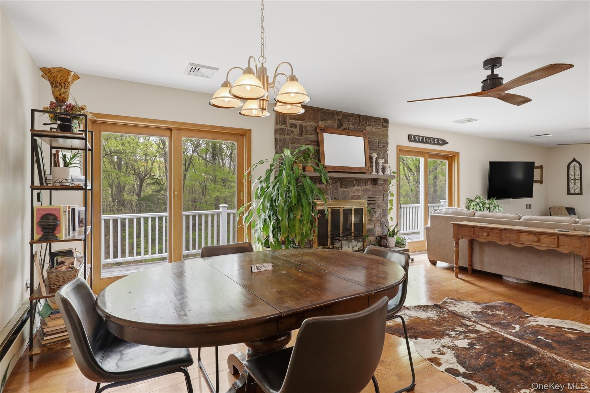 128 Sawmill Road Red Hook, NY 12571 - Photo 15 of 40 a view of a dining room with furniture window and wooden floor
