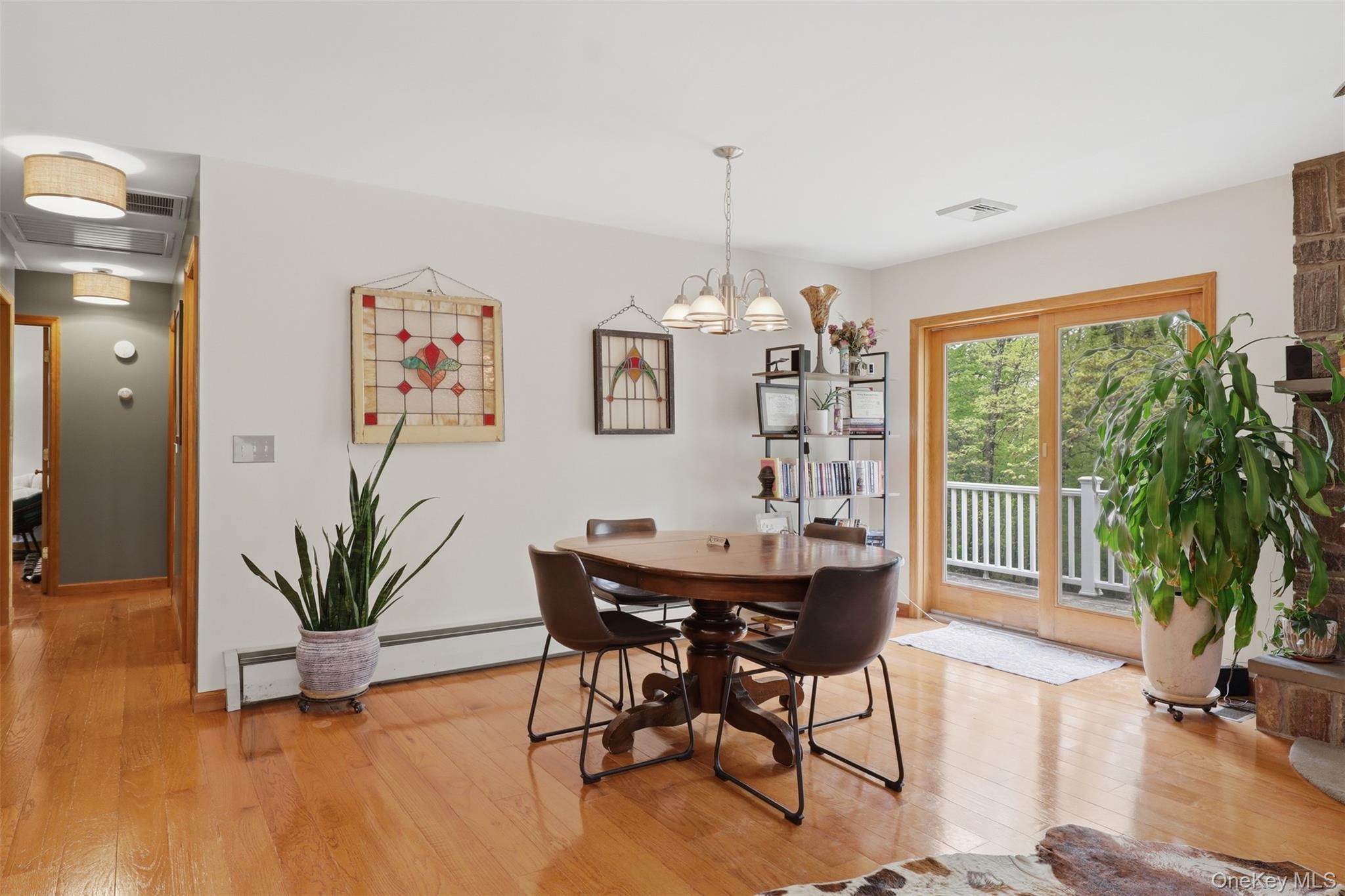 128 Sawmill Road Red Hook, NY 12571 - Photo 16 of 40 a view of a dining room with furniture window and wooden floor
