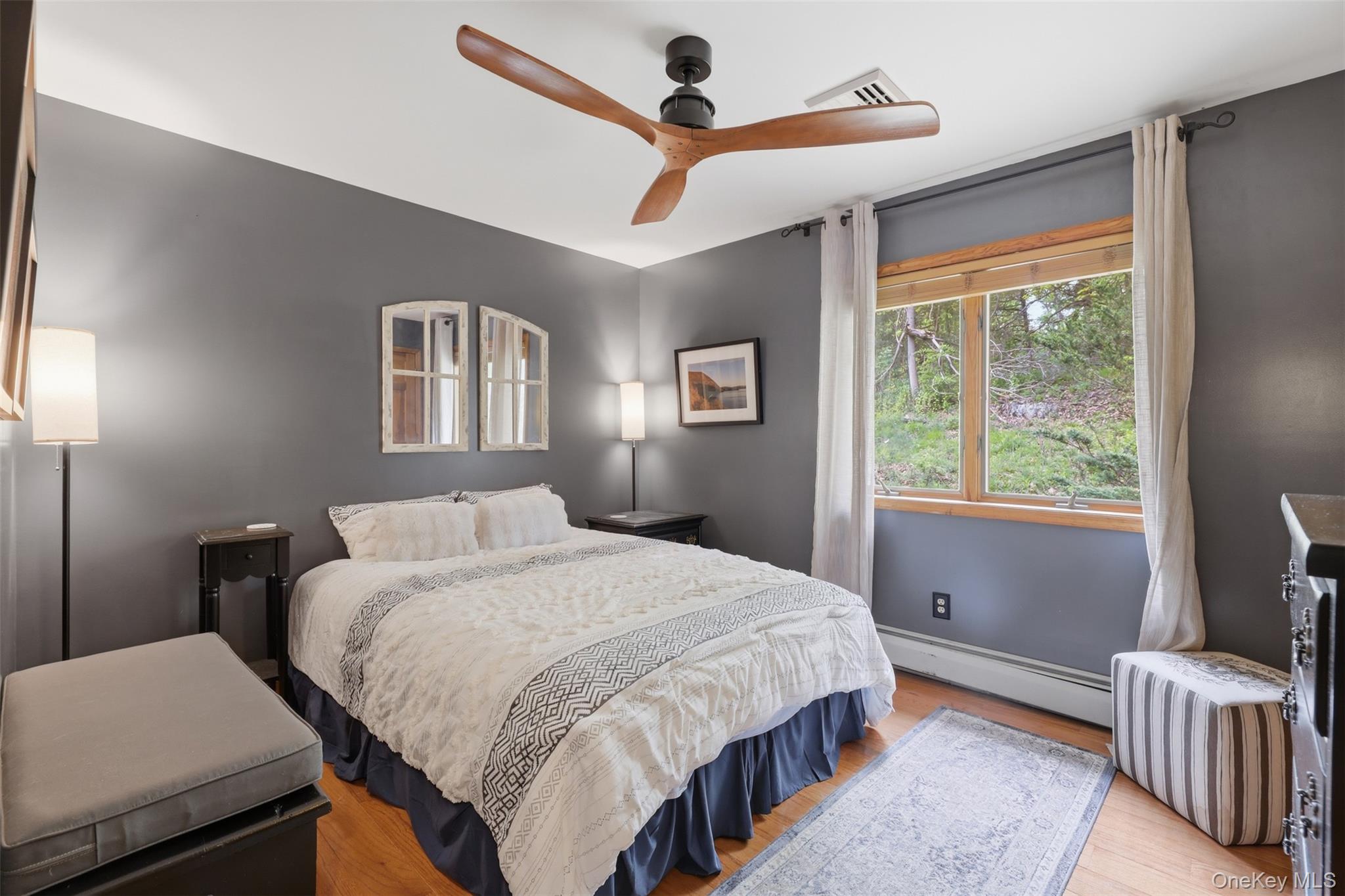 128 Sawmill Road Red Hook, NY 12571 - Photo 17 of 40 a bedroom with a bed bookshelf and a window