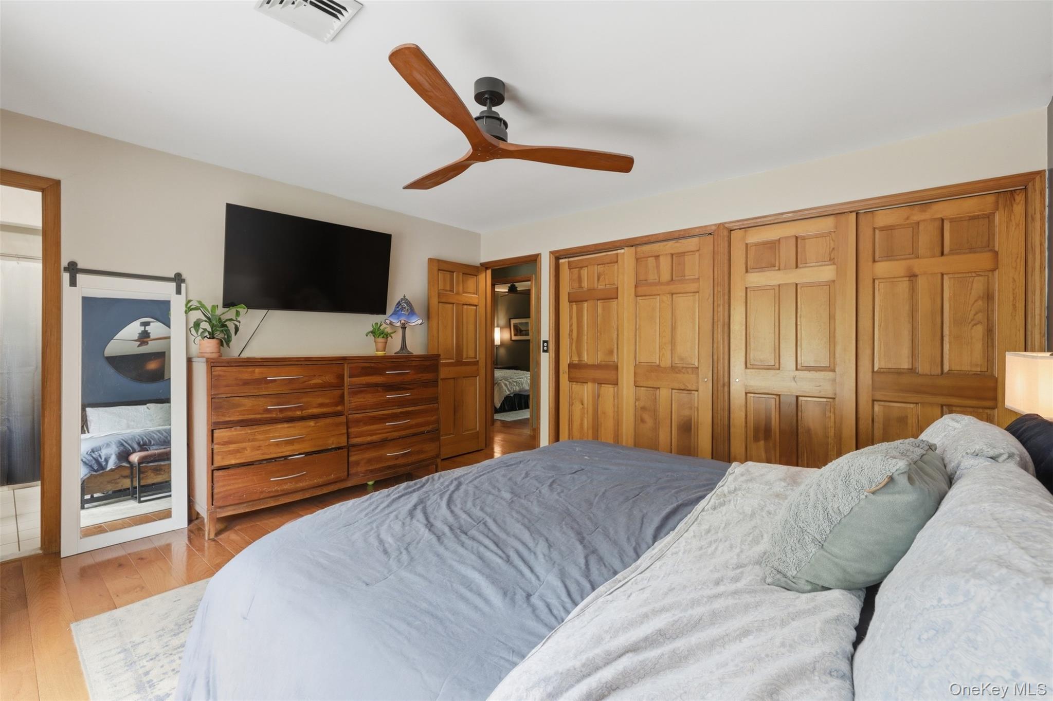 128 Sawmill Road Red Hook, NY 12571 - Photo 18 of 40 a bedroom with a bed and a flat screen tv