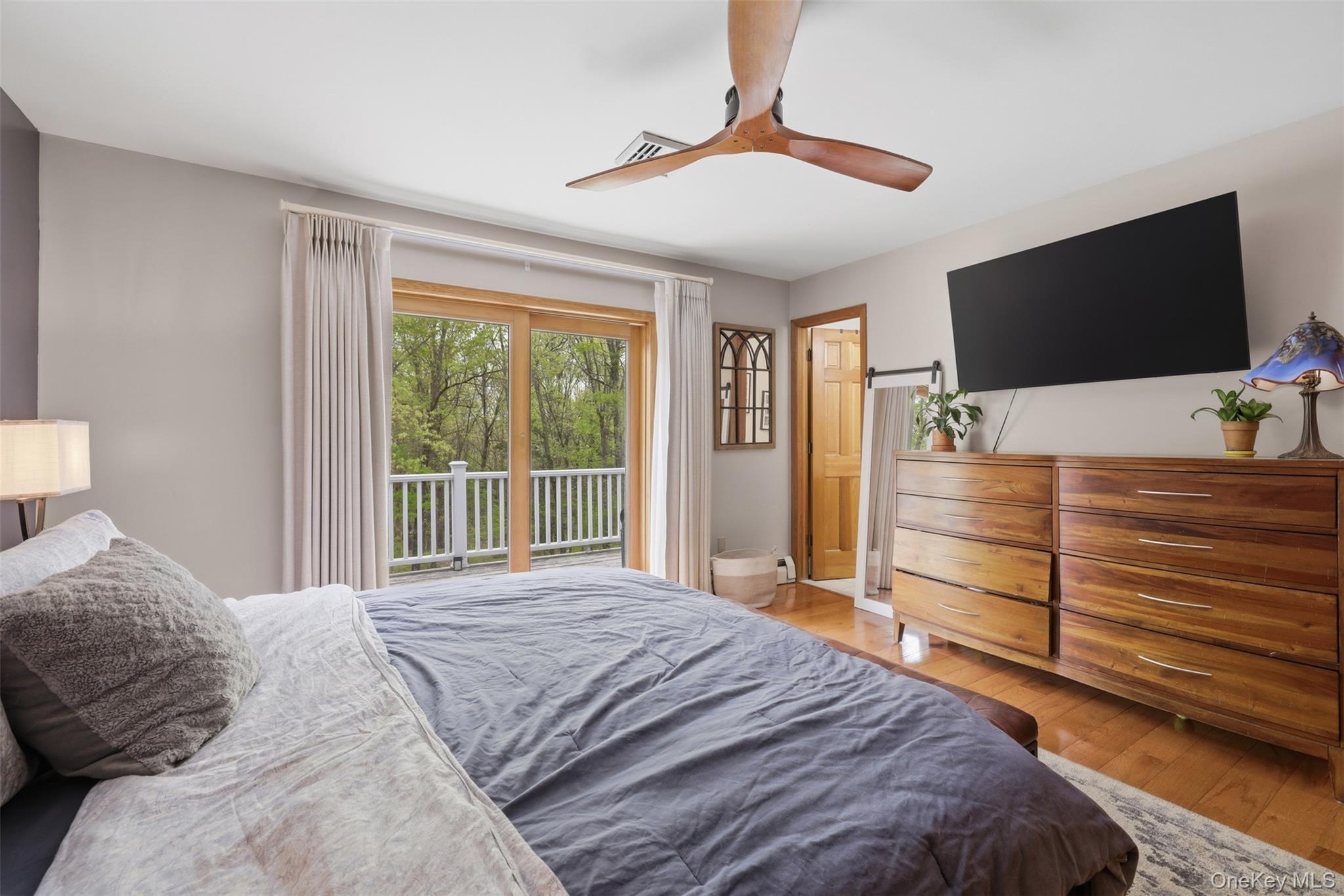 128 Sawmill Road Red Hook, NY 12571 - Photo 20 of 40 a bedroom with a bed and a flat screen tv