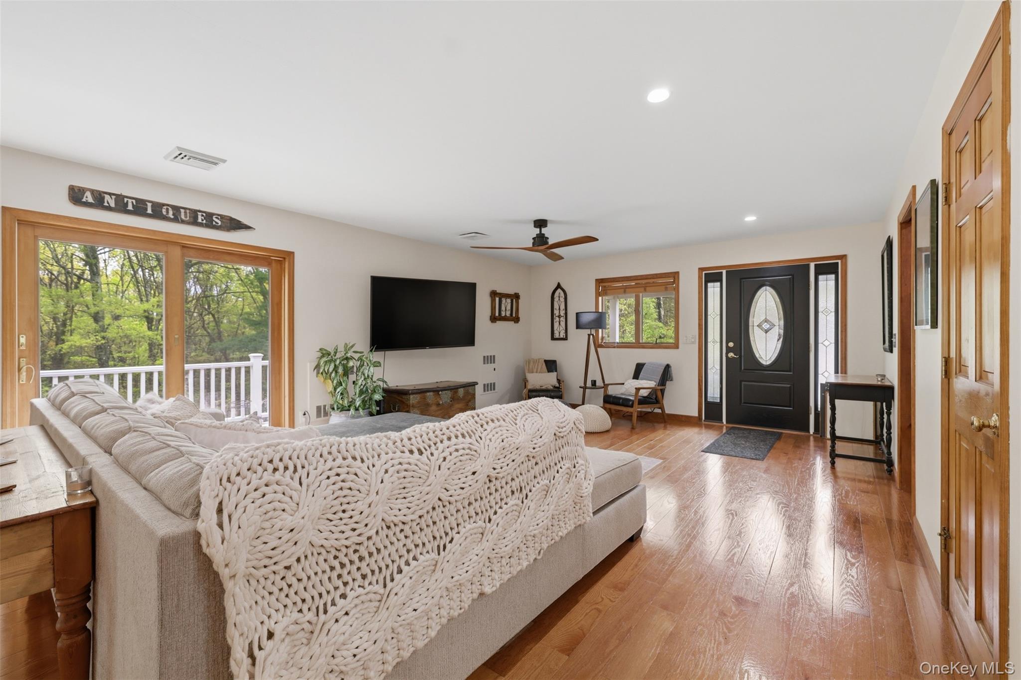 128 Sawmill Road Red Hook, NY 12571 - Photo 4 of 40 a living room with furniture and a flat screen tv