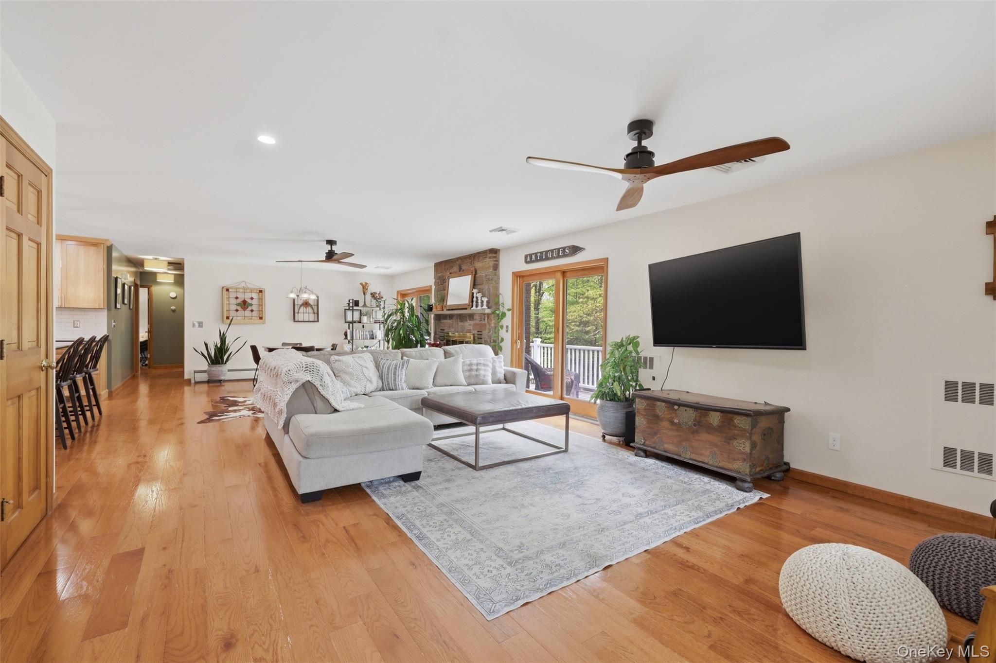 128 Sawmill Road Red Hook, NY 12571 - Photo 6 of 40 a living room with furniture and a flat screen tv