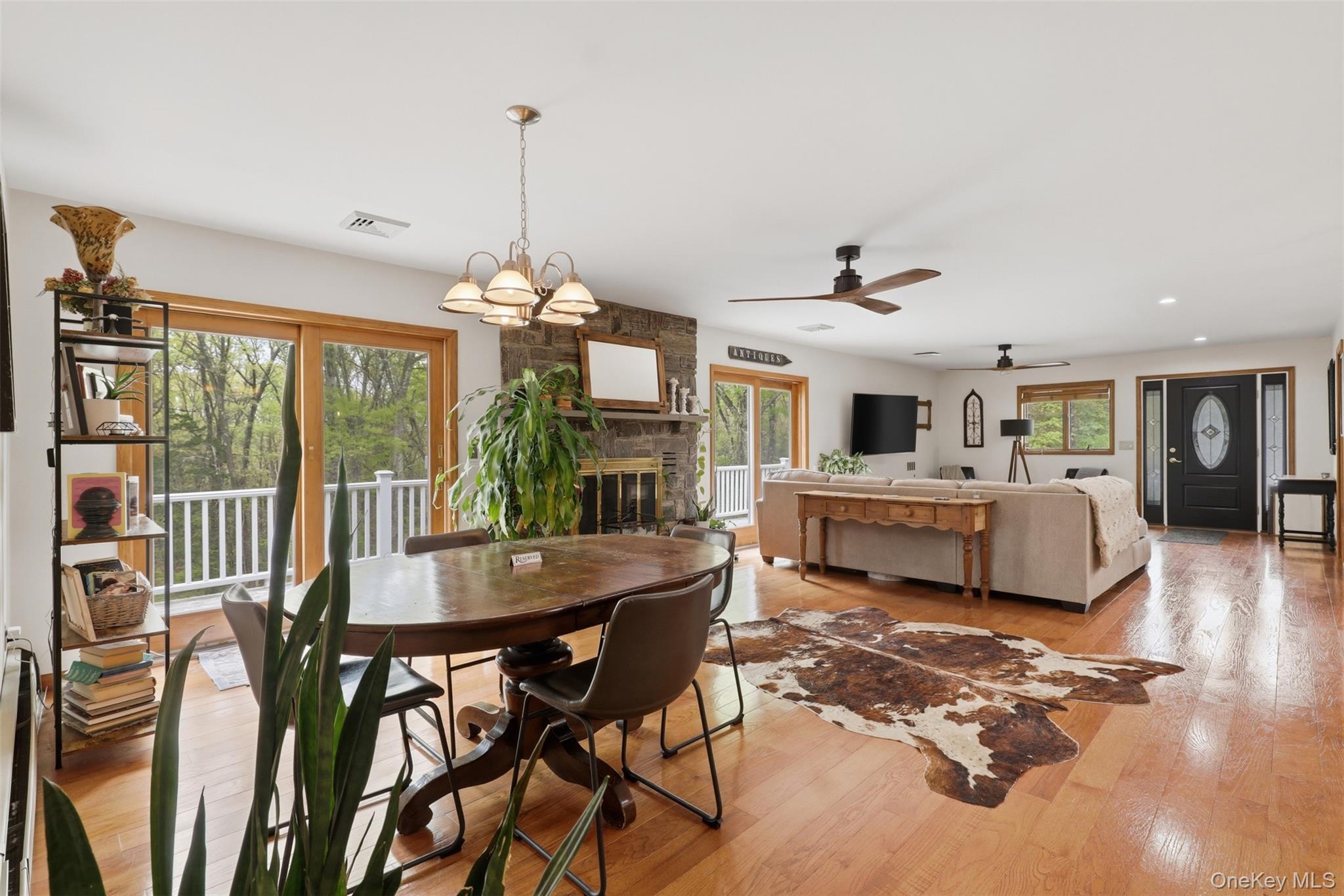 128 Sawmill Road Red Hook, NY 12571 - Photo 7 of 40 a living room with furniture and a chandelier