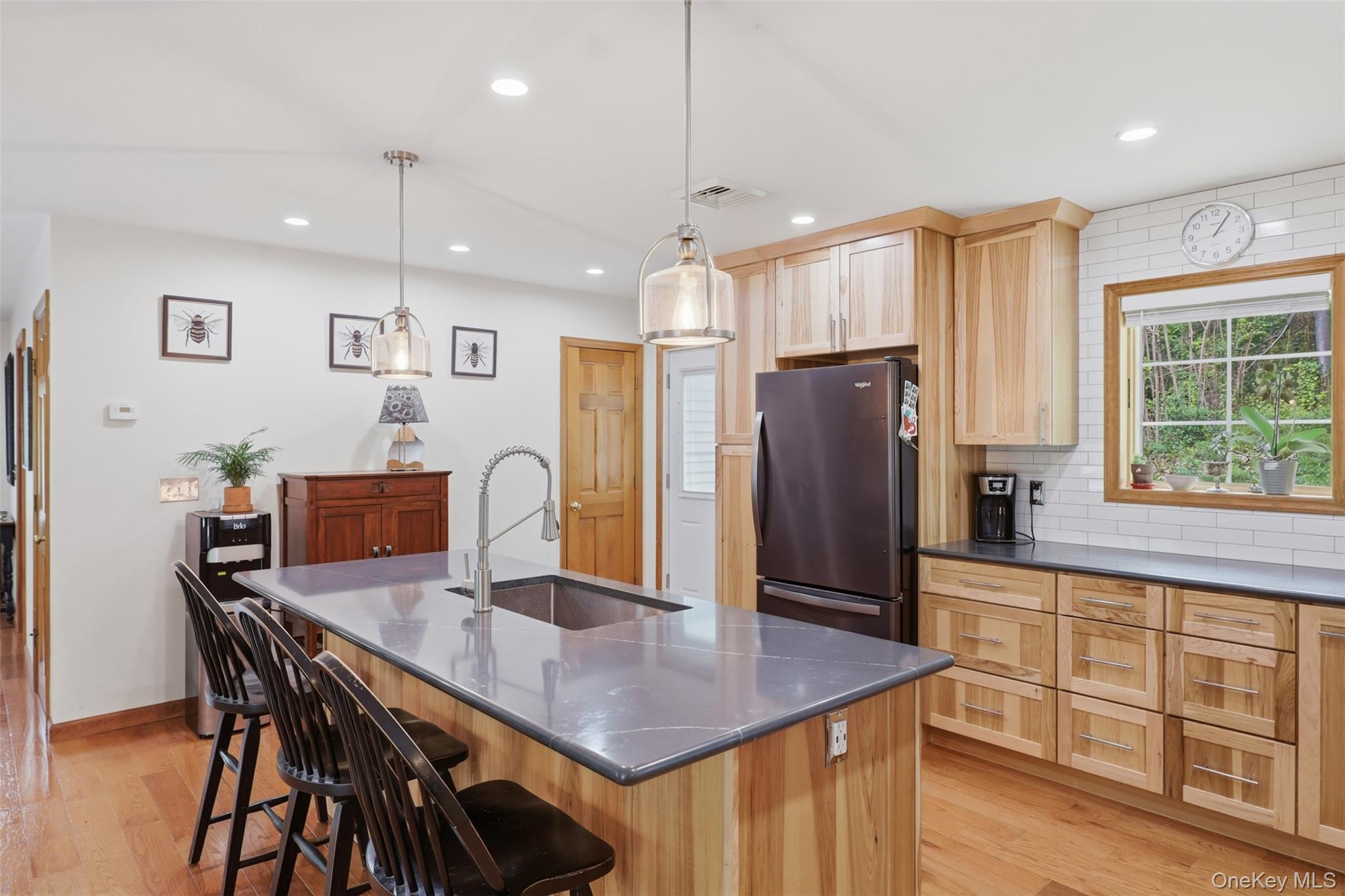 128 Sawmill Road Red Hook, NY 12571 - Photo 10 of 40 a kitchen with granite countertop a table chairs refrigerator and cabinets