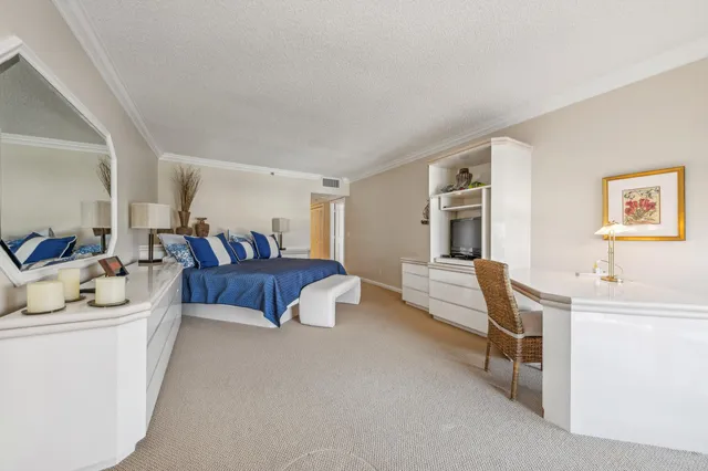 a living room with furniture and a dining table