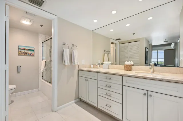 a bathroom with a double vanity sink mirror and double