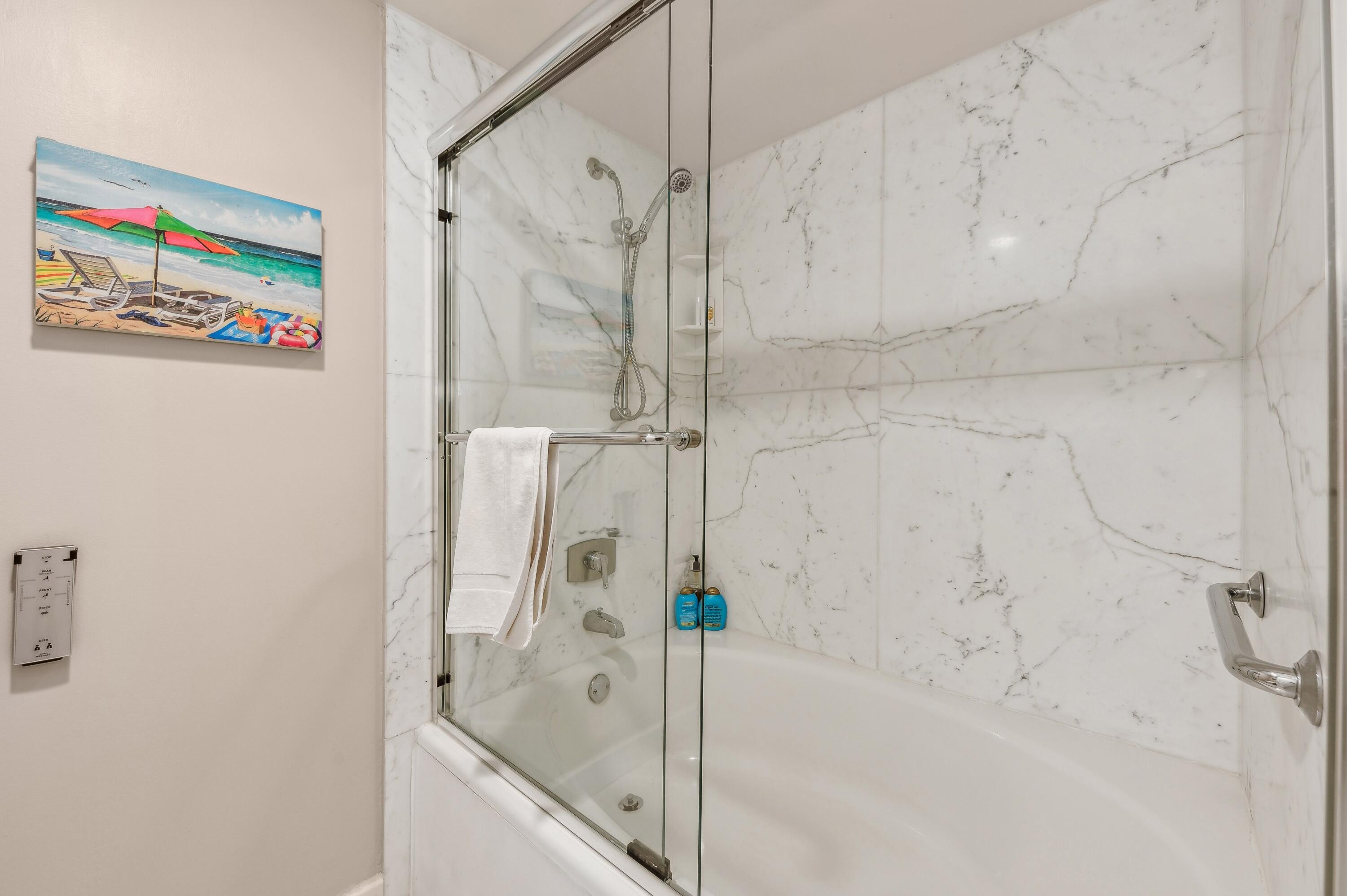 4748 South Ocean Boulevard, Unit 802 Highland Beach, FL 33487 - Photo 16 of 27 a bathroom with a bathtub and a shower