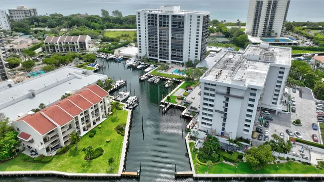 an aerial view of multiple houses with yard