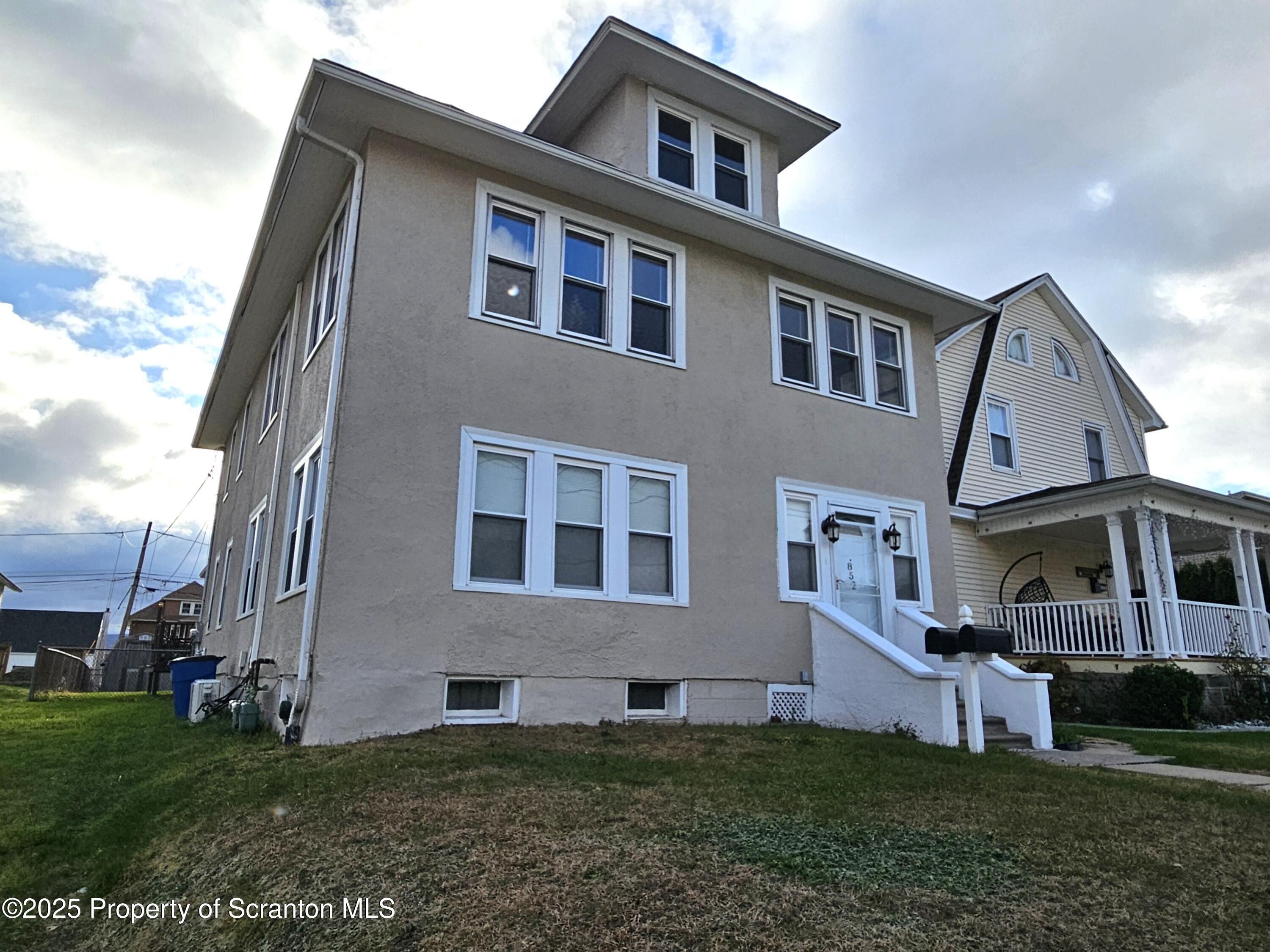 852 North Rebecca Avenue, Unit 2 Scranton, PA 18504 - Photo 11 of 13 a front view of a house with a yard