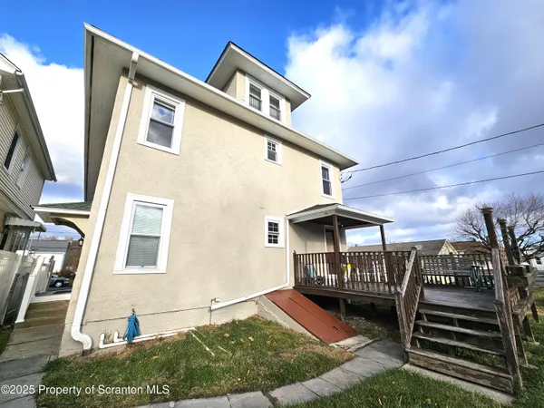 a view of front door of house with stairs