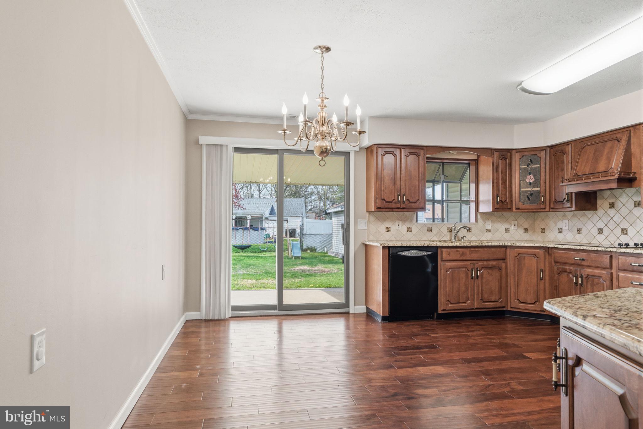 802 Eldridge Road Fairless Hills, PA 19030 - Photo 17 of 32 a kitchen with stainless steel appliances granite countertop a stove top oven and sink