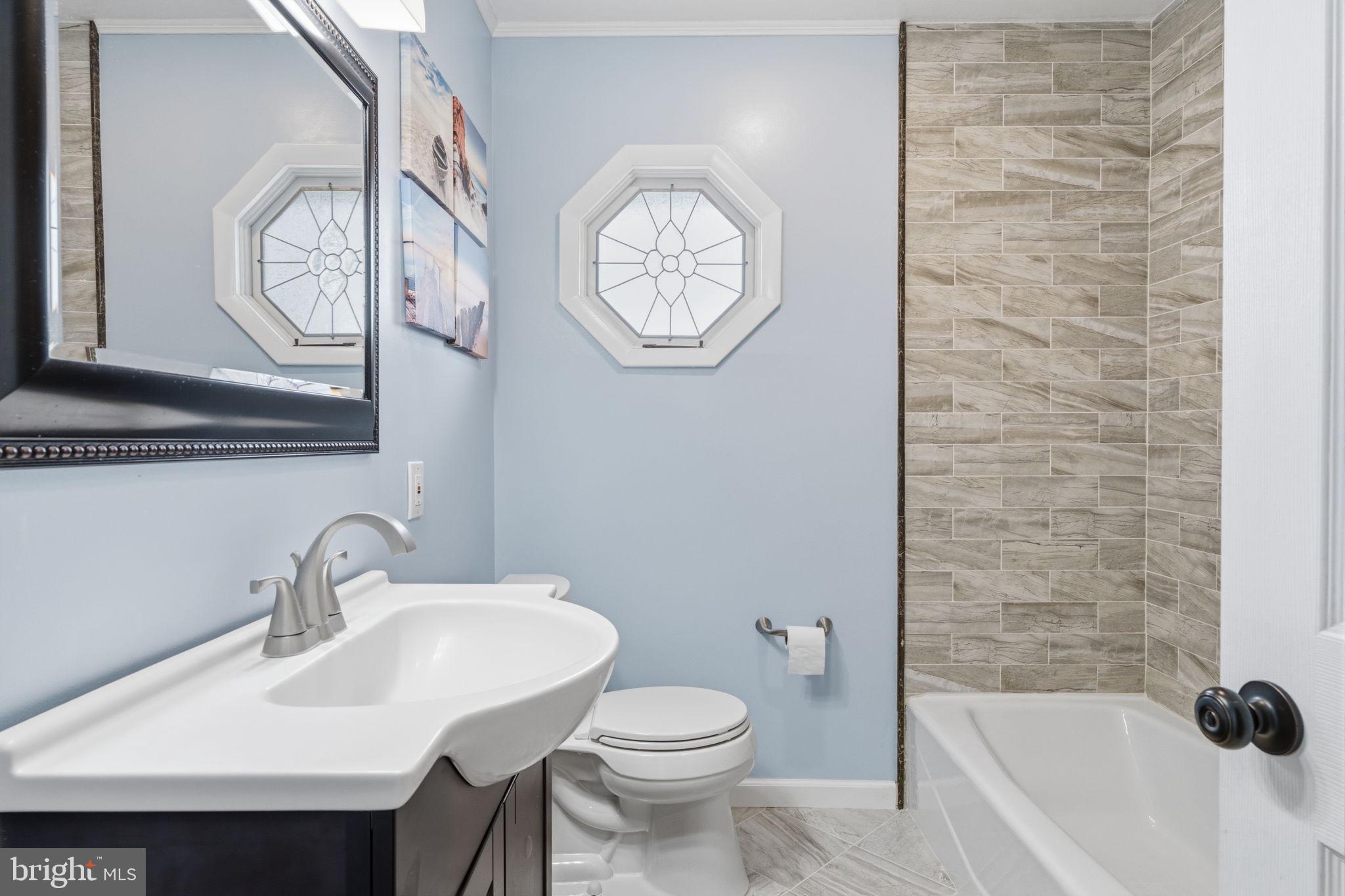 802 Eldridge Road Fairless Hills, PA 19030 - Photo 20 of 32 a bathroom with a sink a toilet and a bathtub