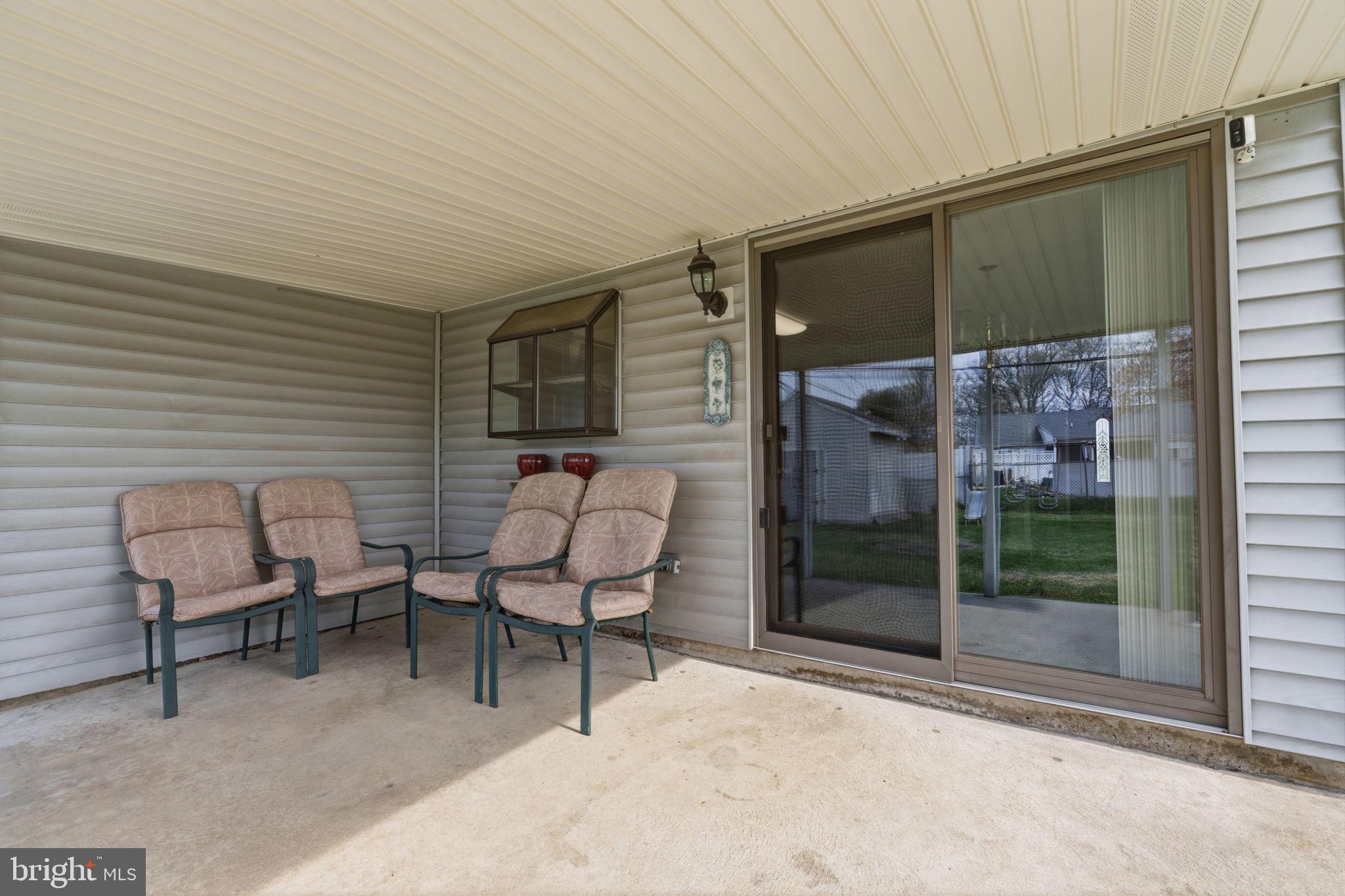 802 Eldridge Road Fairless Hills, PA 19030 - Photo 27 of 32 a backyard of a house with barbeque oven table and chairs