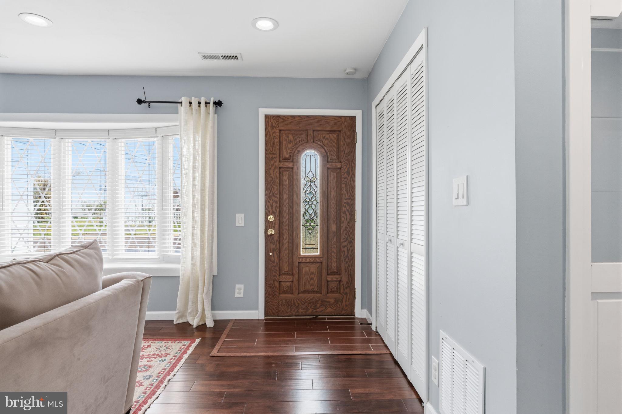 802 Eldridge Road Fairless Hills, PA 19030 - Photo 7 of 32 a view of a livingroom with wooden floor and windows