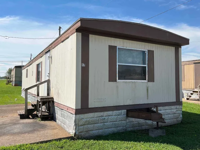 a view of house with backyard