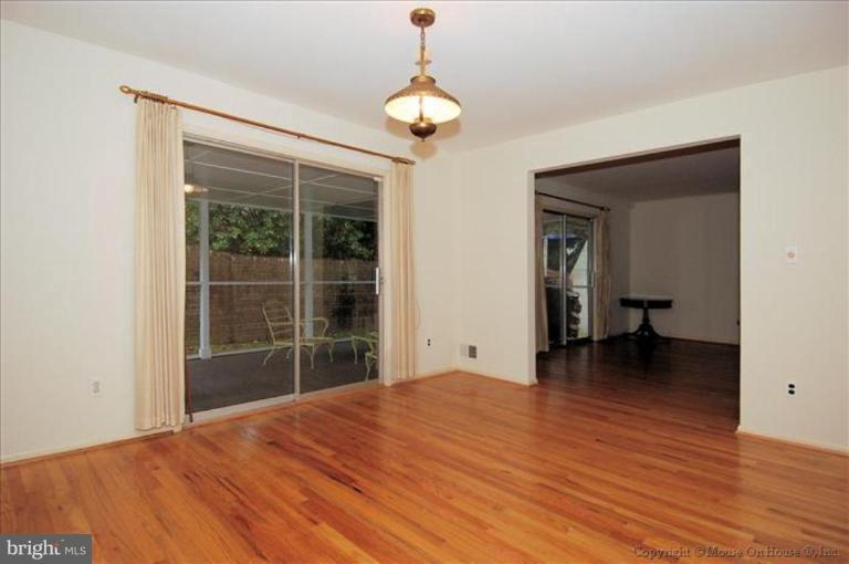 12809 Broadmore Road Silver Spring, MD 20904 - Photo 5 of 19 a view of a room with wooden floor and a ceiling fan