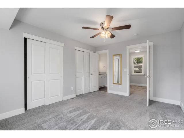 a view of an empty room and closet area