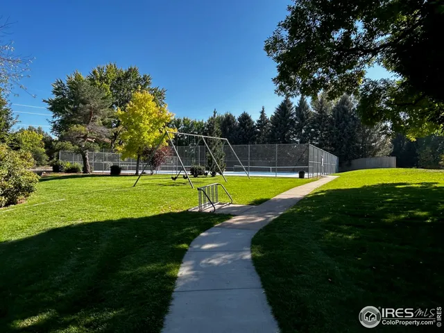 a view of a swimming pool with a yard