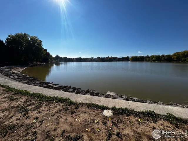 a view of a lake next to a building with a lake