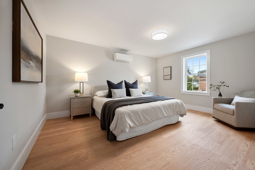 3-5 Victoria Road, Unit 3 Arlington, MA 02474 - Photo 13 of 36 a bedroom with a bed and a couch