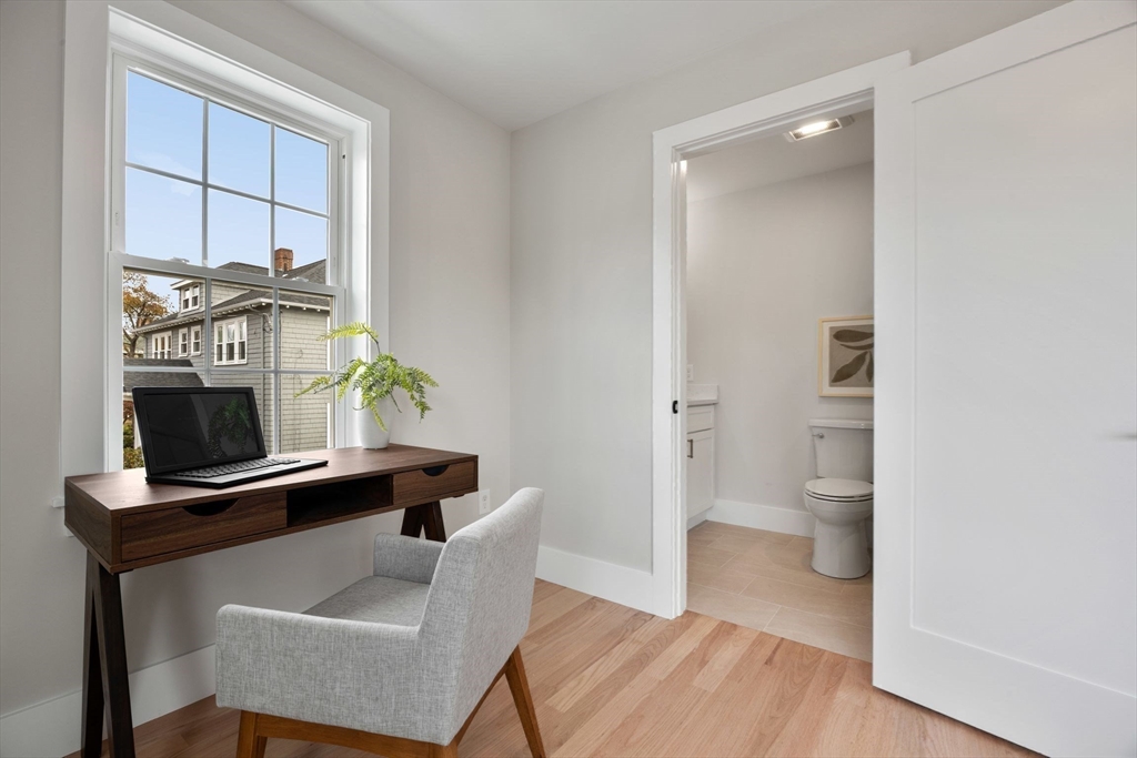 3-5 Victoria Road, Unit 3 Arlington, MA 02474 - Photo 25 of 36 a view of kitchen with furniture and wooden floor