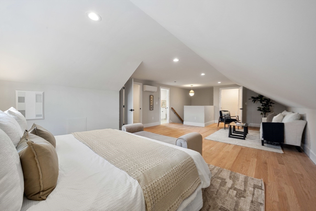 3-5 Victoria Road, Unit 3 Arlington, MA 02474 - Photo 29 of 36 a large bedroom with a bed and furniture