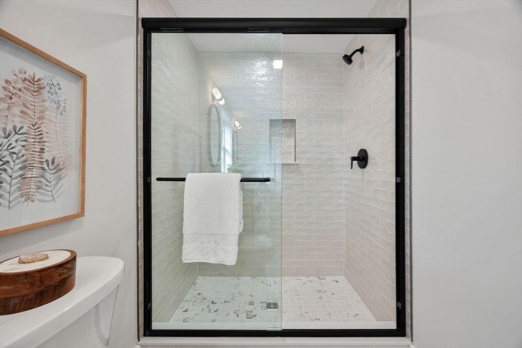 3-5 Victoria Road, Unit 3 Arlington, MA 02474 - Photo 32 of 36 a bathroom with a shower