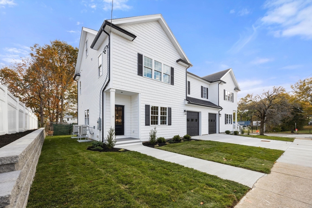 3-5 Victoria Road, Unit 3 Arlington, MA 02474 - Photo 34 of 36 a front view of house with yard and green space
