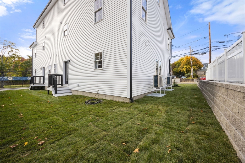 3-5 Victoria Road, Unit 3 Arlington, MA 02474 - Photo 35 of 36 a view of a backyard
