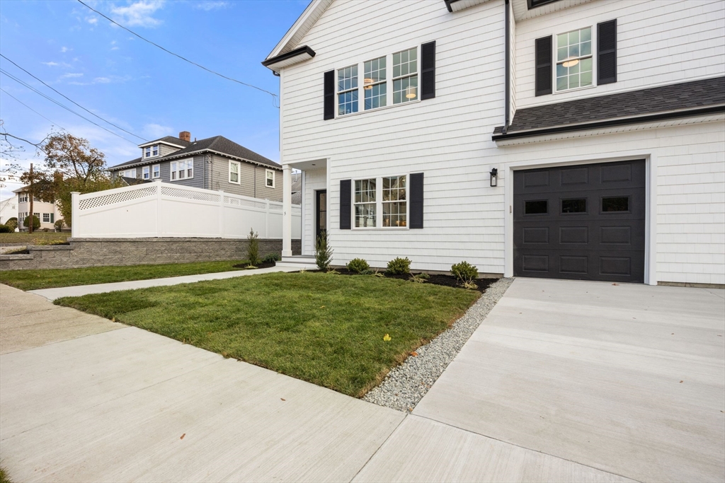 3-5 Victoria Road, Unit 3 Arlington, MA 02474 - Photo 36 of 36 a front view of a house with a garden