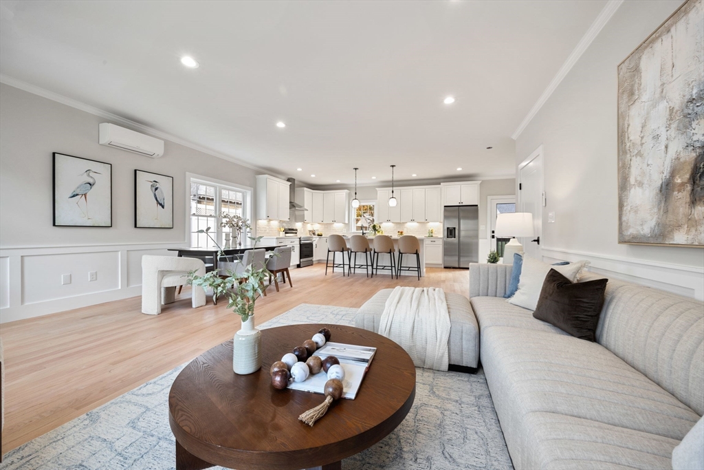 3-5 Victoria Road, Unit 3 Arlington, MA 02474 - Photo 5 of 36 a living room with furniture kitchen view and a table