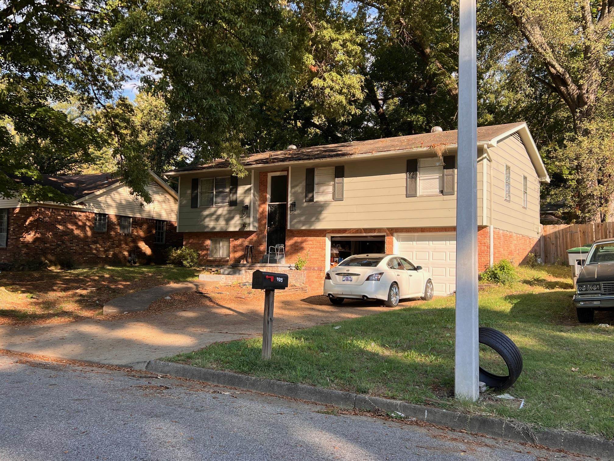 a view of a parked cars in front of a house