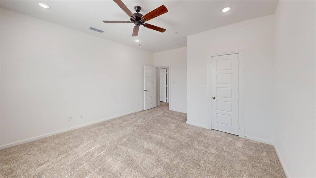 285 Buck Ridge Drive Frisco, TX 75068 - Photo 12 of 20 Unfurnished bedroom featuring ceiling fan, recessed lighting, and light carpet