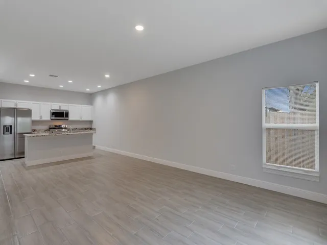 a view of kitchen with wooden floor