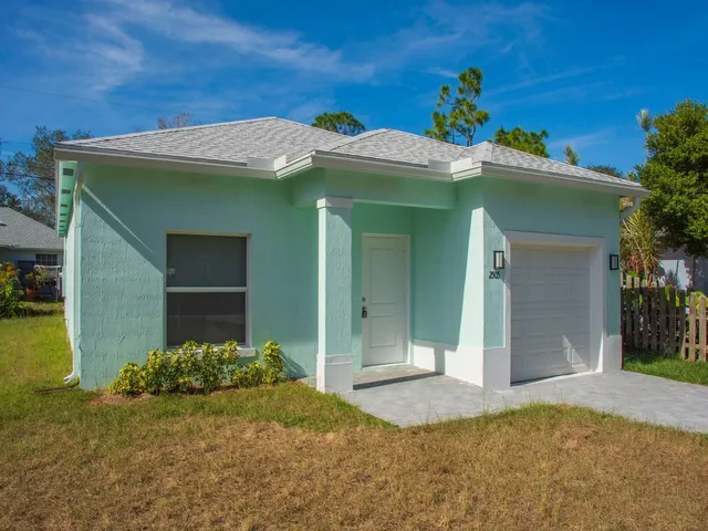 a view of a house with a garage