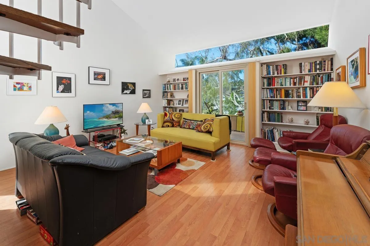 4875 Academy Street San Diego, CA 92109 - Photo 2 of 33 a living room with furniture a rug and a large window