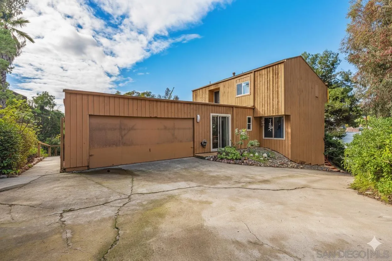 4875 Academy Street San Diego, CA 92109 - Photo 32 of 33 a view of a house with backyard and bushes