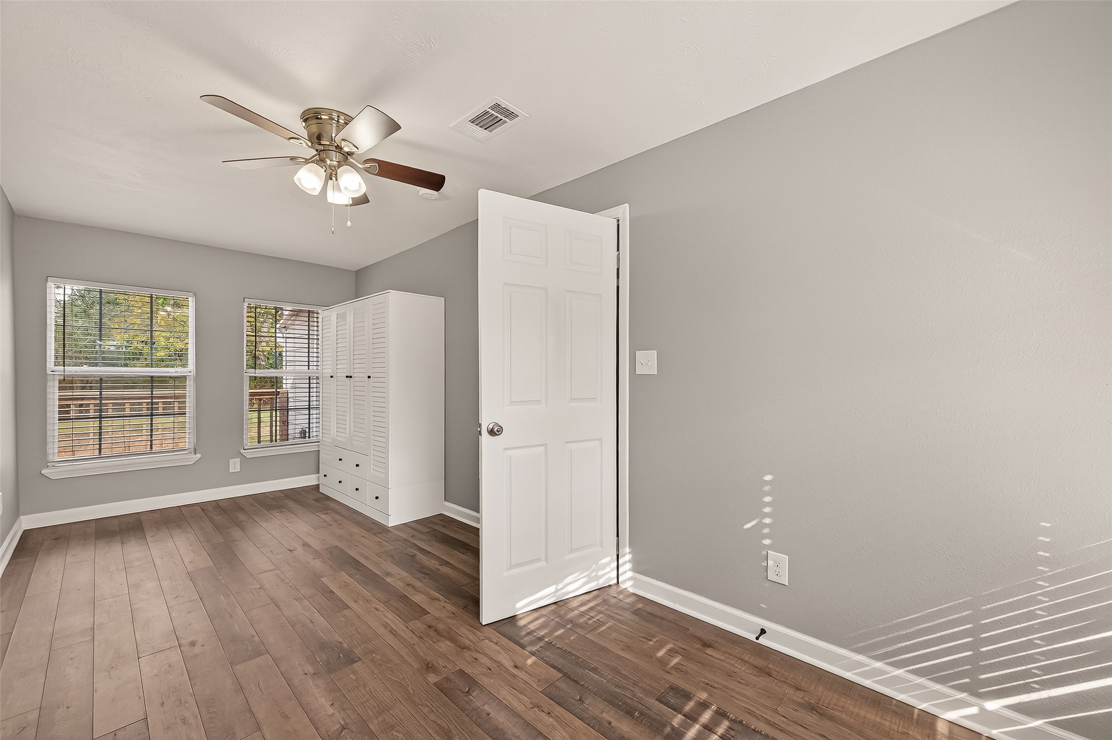 6615 Kernel Street Houston, TX 77087 - Photo 12 of 20 a view of an empty room with wooden floor and a window