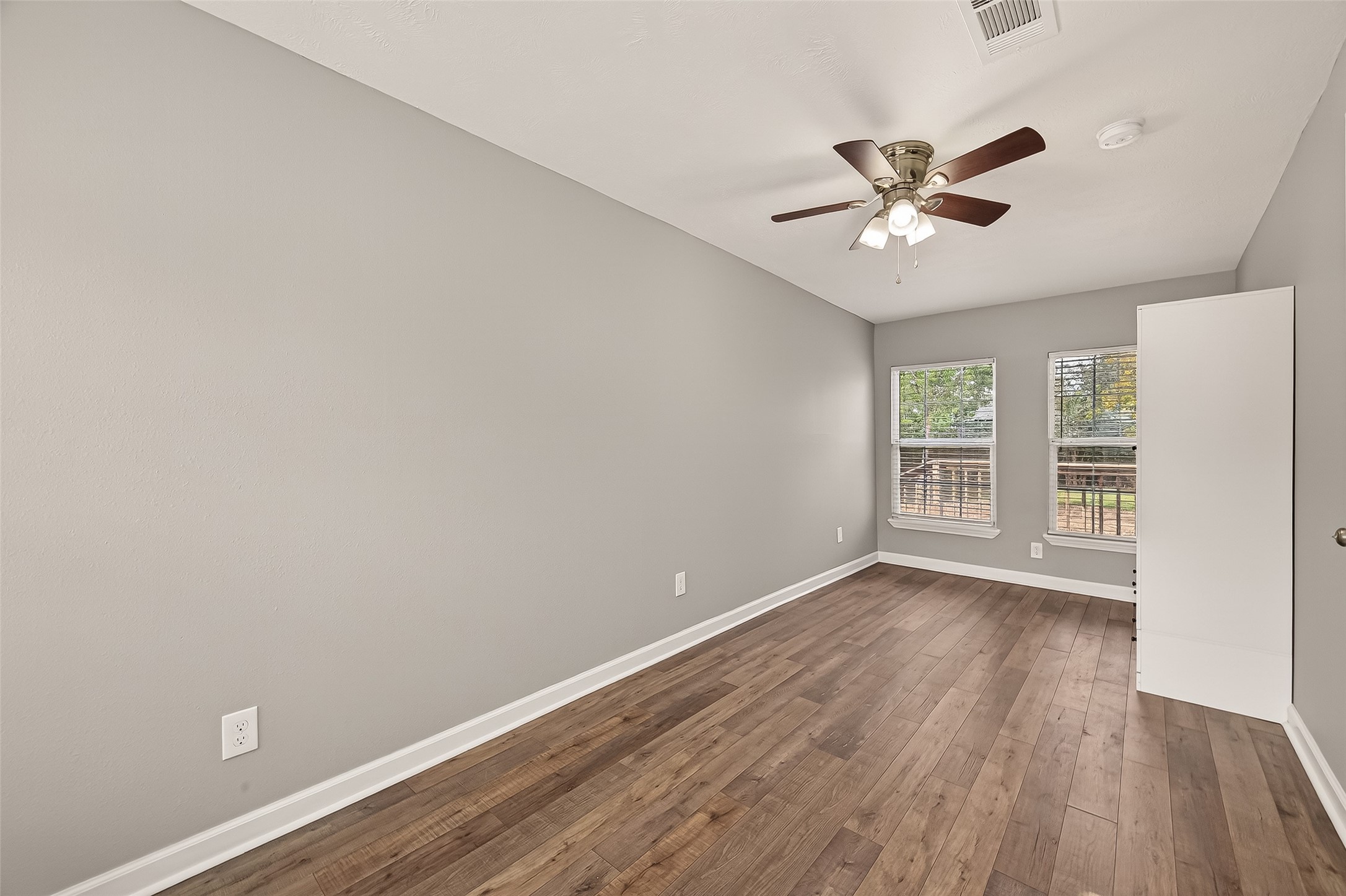 6615 Kernel Street Houston, TX 77087 - Photo 13 of 20 a view of a big room with wooden floor and windows