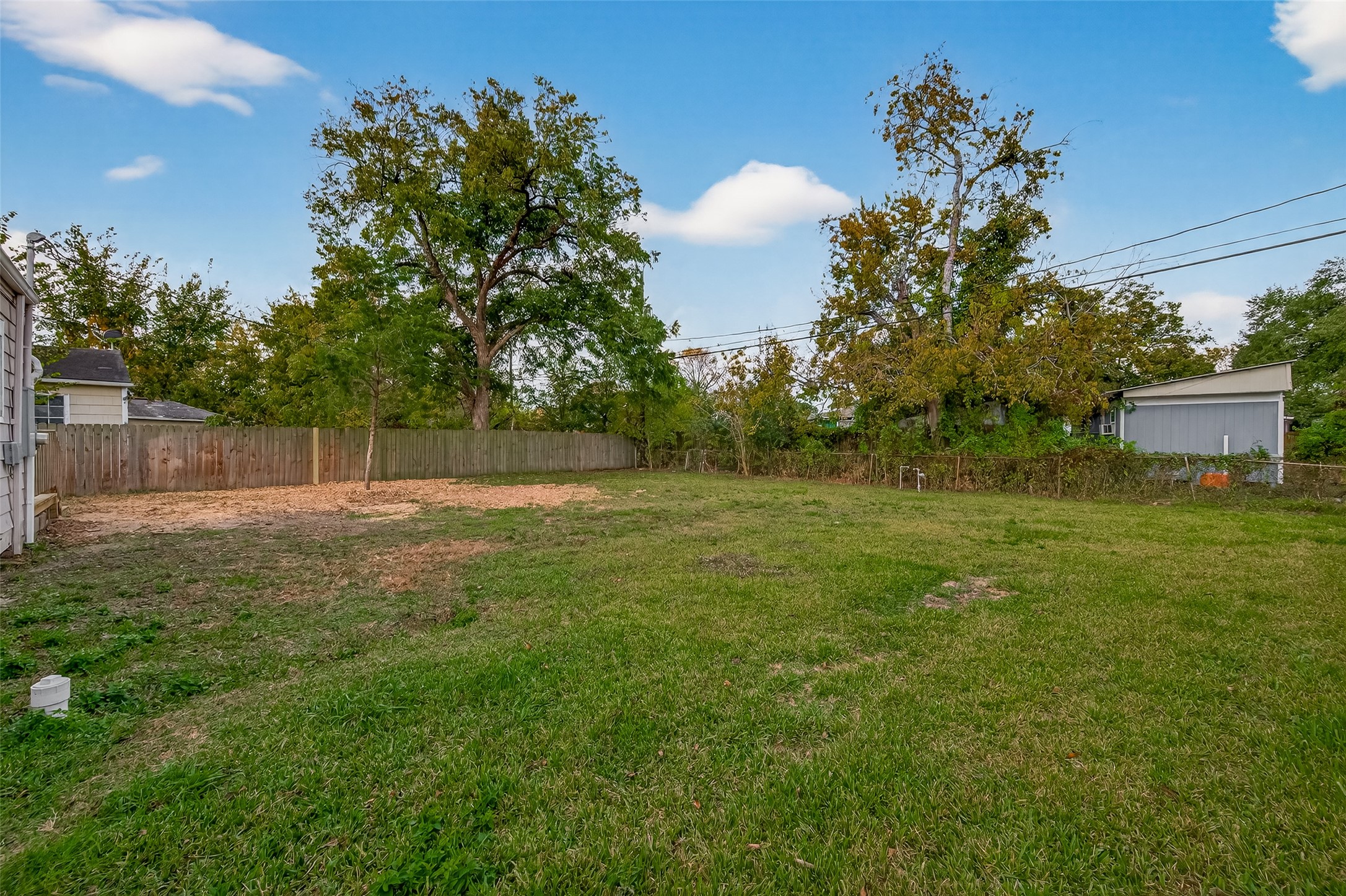 6615 Kernel Street Houston, TX 77087 - Photo 18 of 20 a backyard of a house with lots of green space
