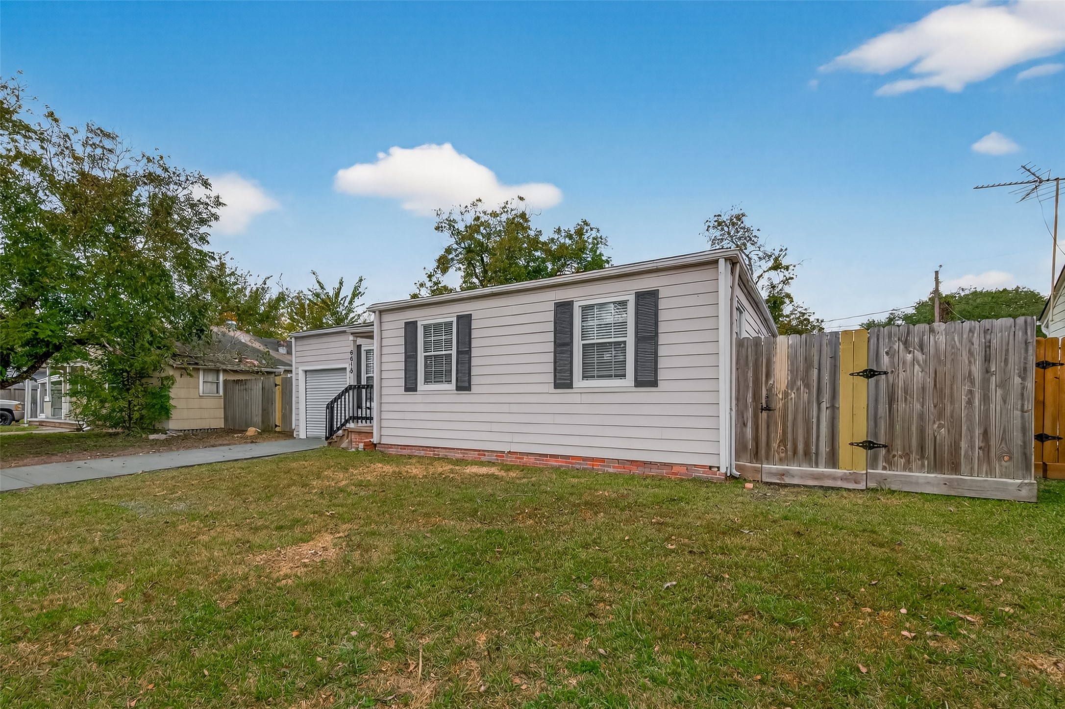 6615 Kernel Street Houston, TX 77087 - Photo 20 of 20 a view of a house with backyard and tree