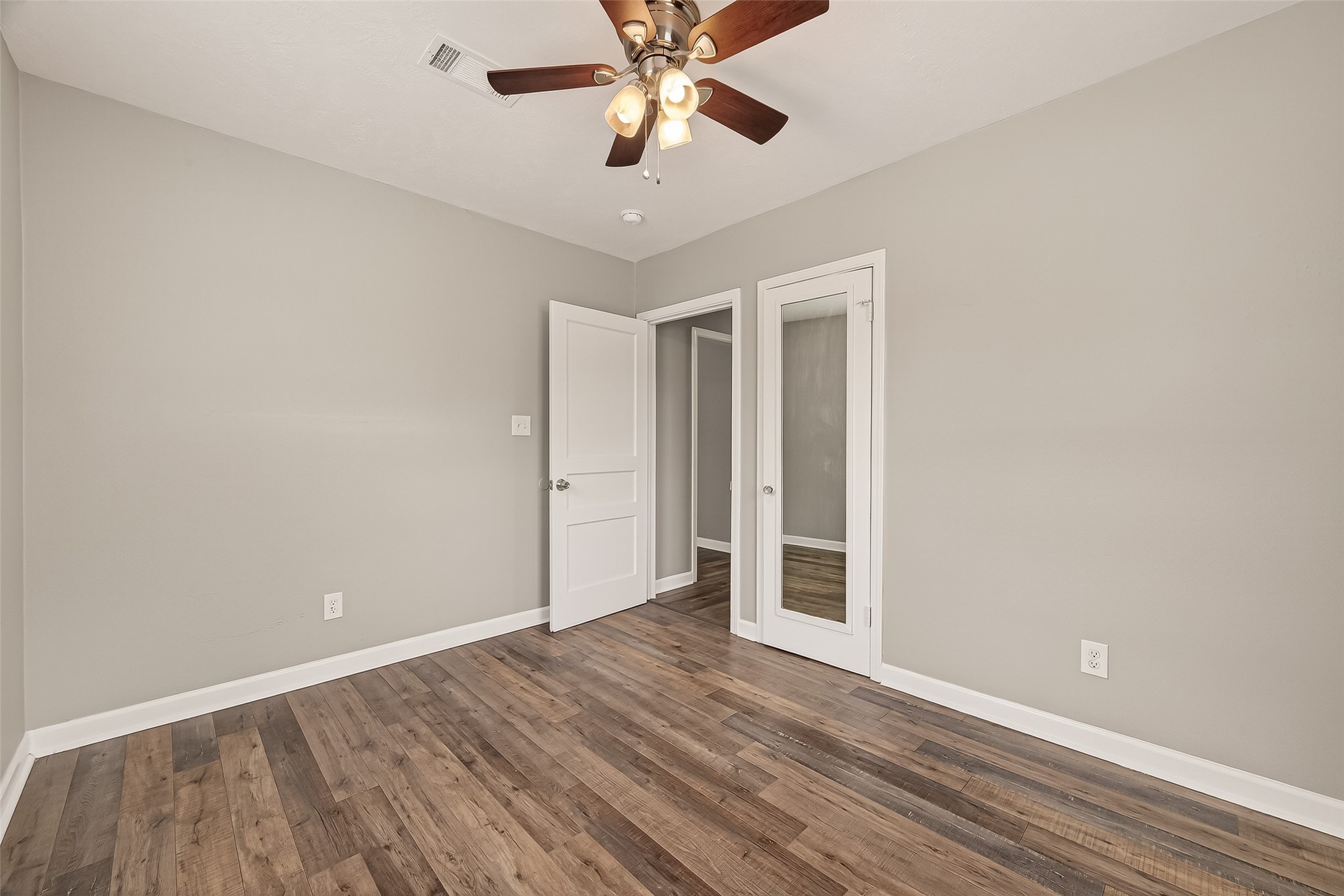 6615 Kernel Street Houston, TX 77087 - Photo 8 of 20 a view of an empty room with window and wooden floor