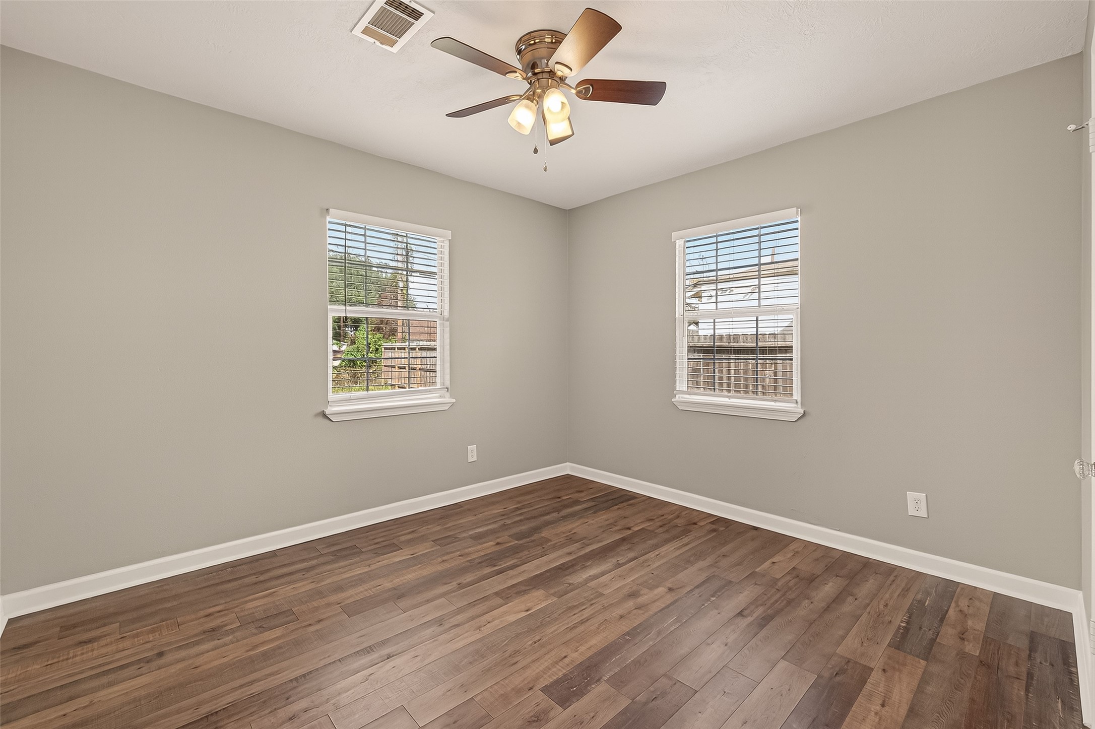 6615 Kernel Street Houston, TX 77087 - Photo 9 of 20 a view of a room with wooden floor and a window