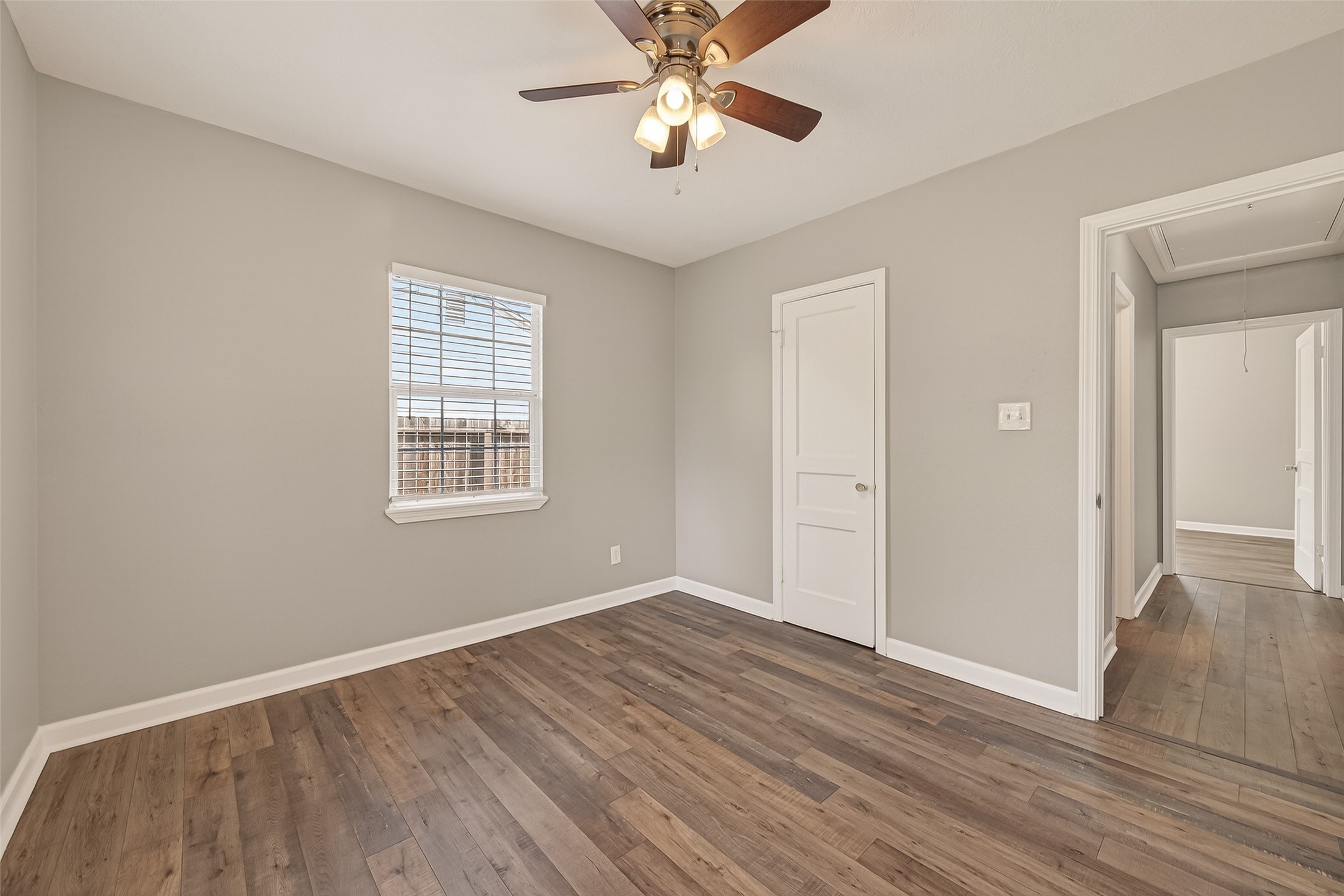 6615 Kernel Street Houston, TX 77087 - Photo 10 of 20 wooden floor in an empty room with a window