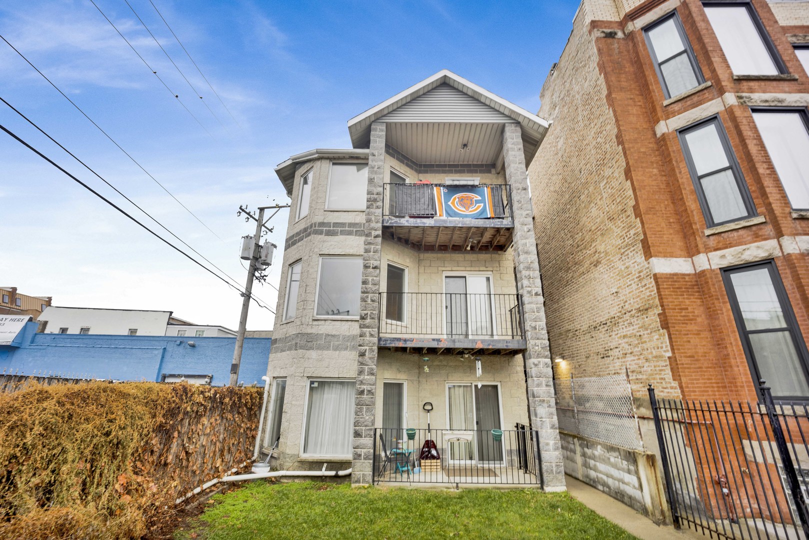 2413 West Polk Street, Unit 2 Chicago, IL 60612 - Photo 1 of 16 a front view of a house with garden