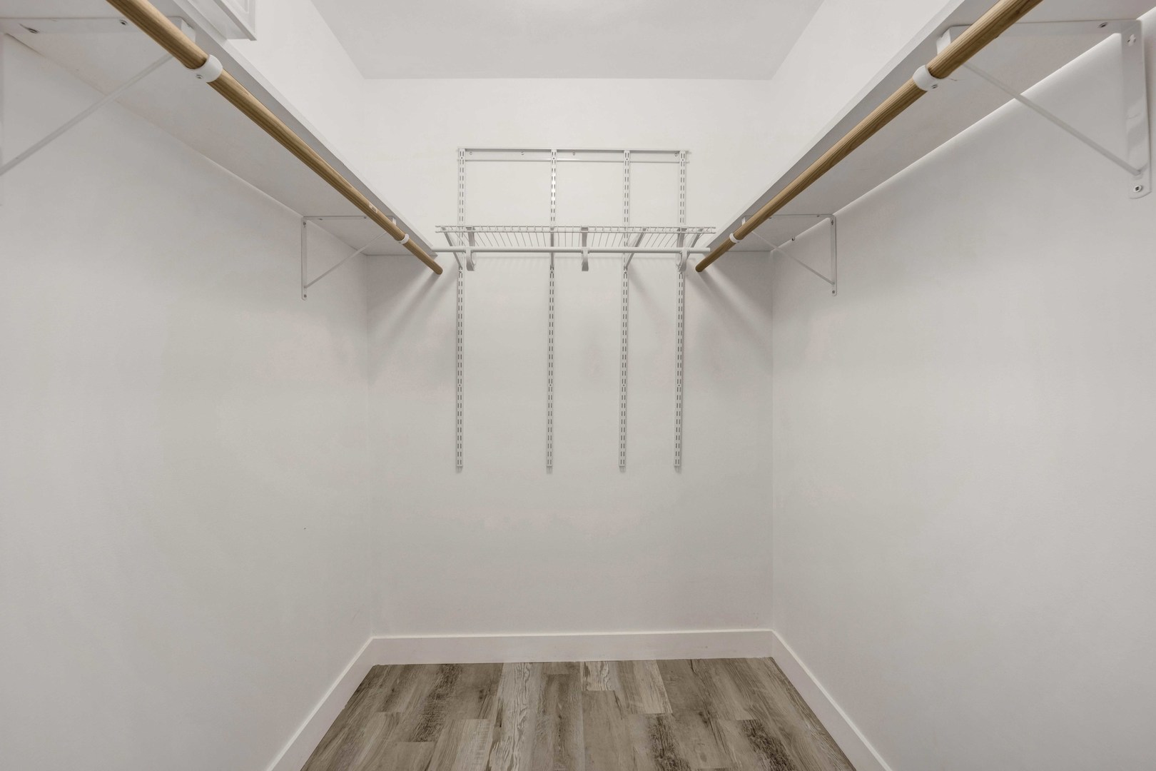 2413 West Polk Street, Unit 2 Chicago, IL 60612 - Photo 12 of 16 a view of walk in closet with empty racks