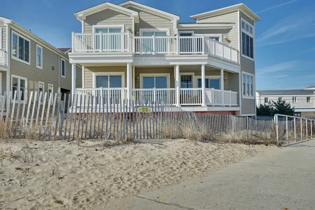 a front view of a house with a fence