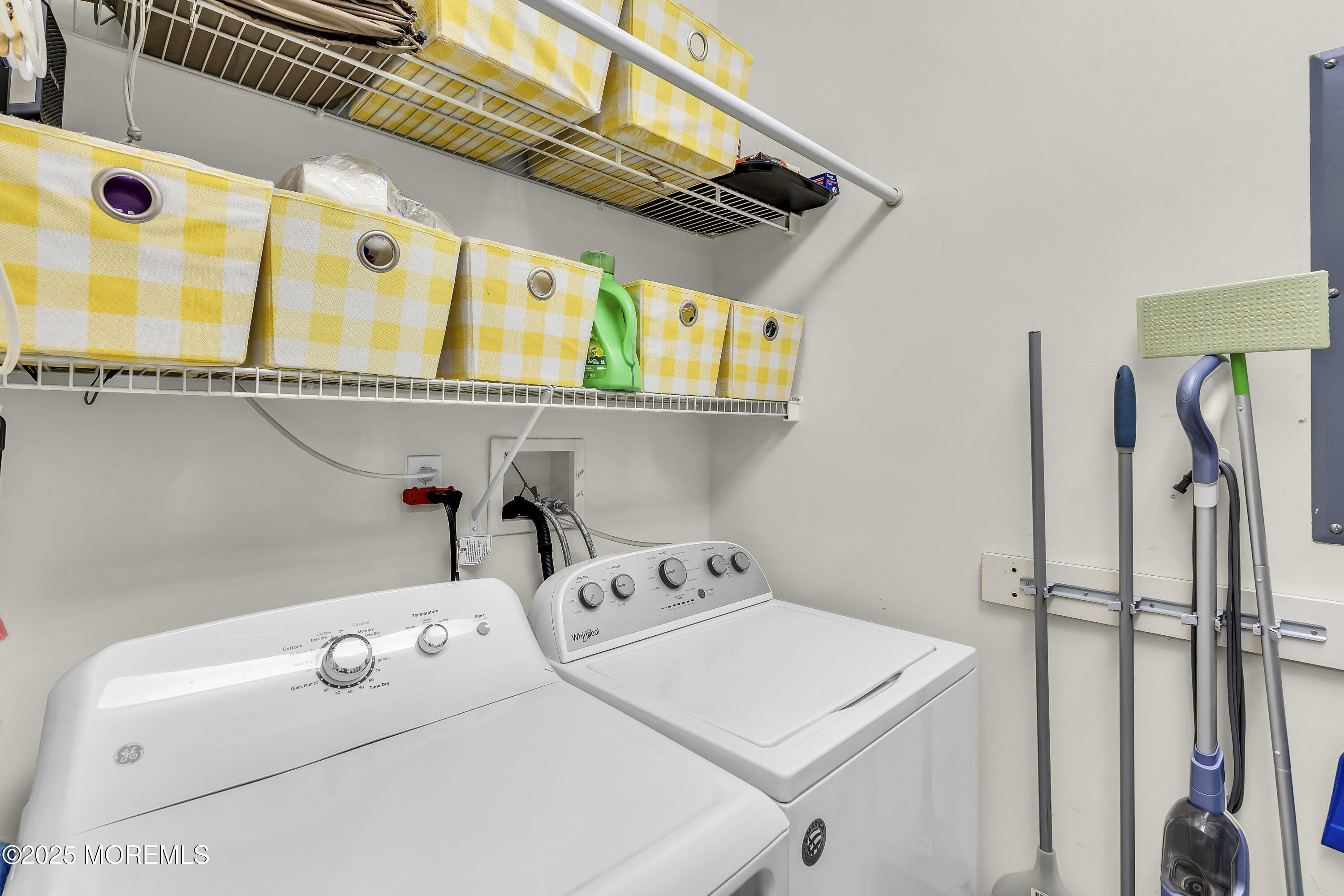 209 Beach Front, Unit 1 Manasquan, NJ 08736 - Photo 15 of 40 a utility room with dryer and washer