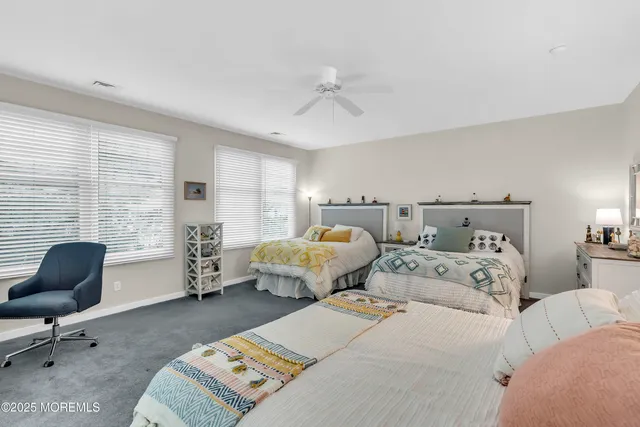 a bed room with two bed and a couch